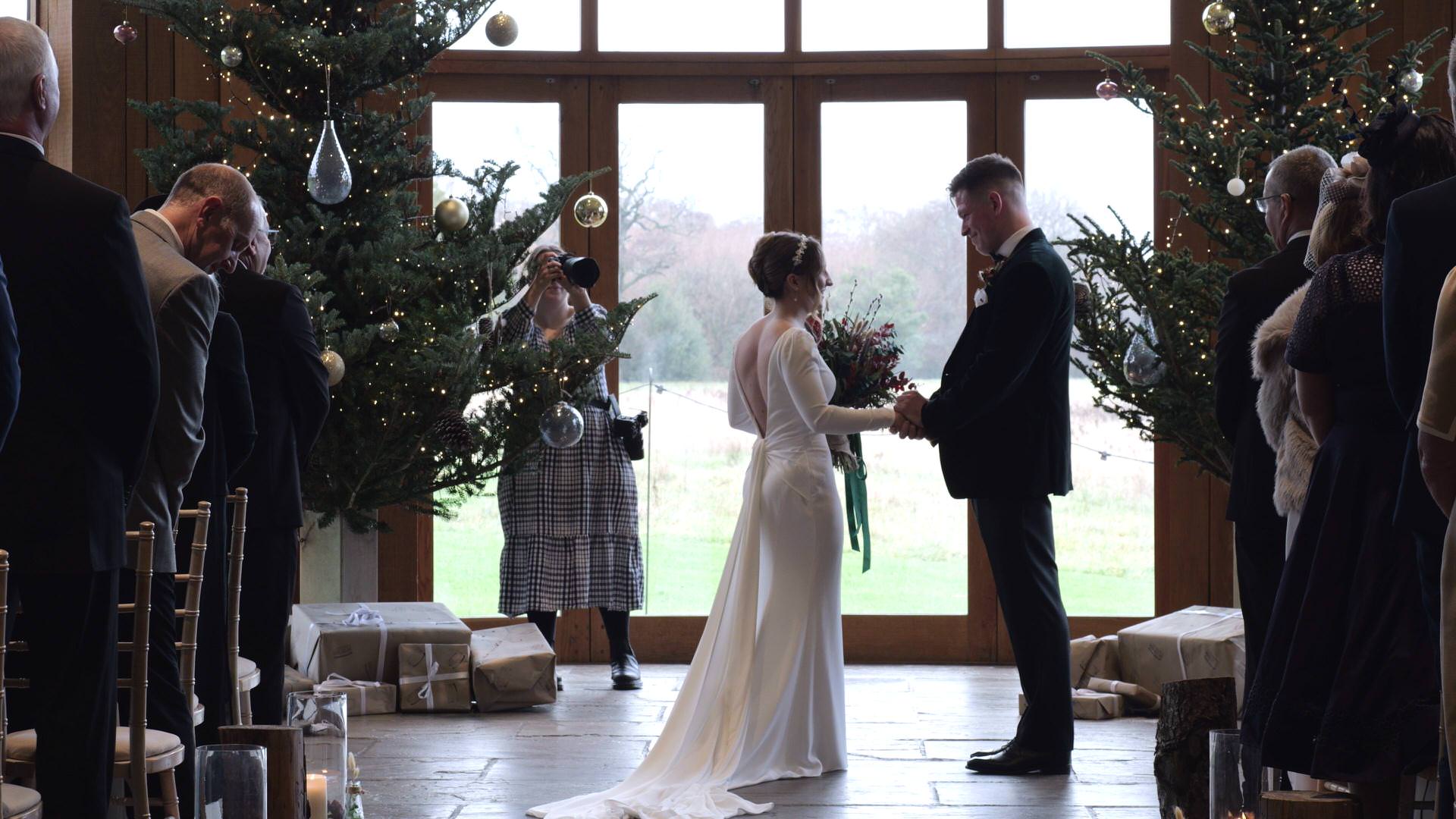 a tender moment captured on video during a winter ceremony at the Out Barn