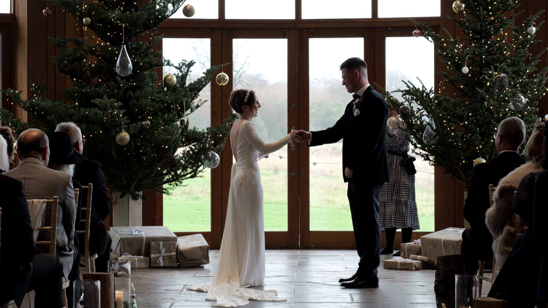 the couple share a fun handshake during their wedding ceremony