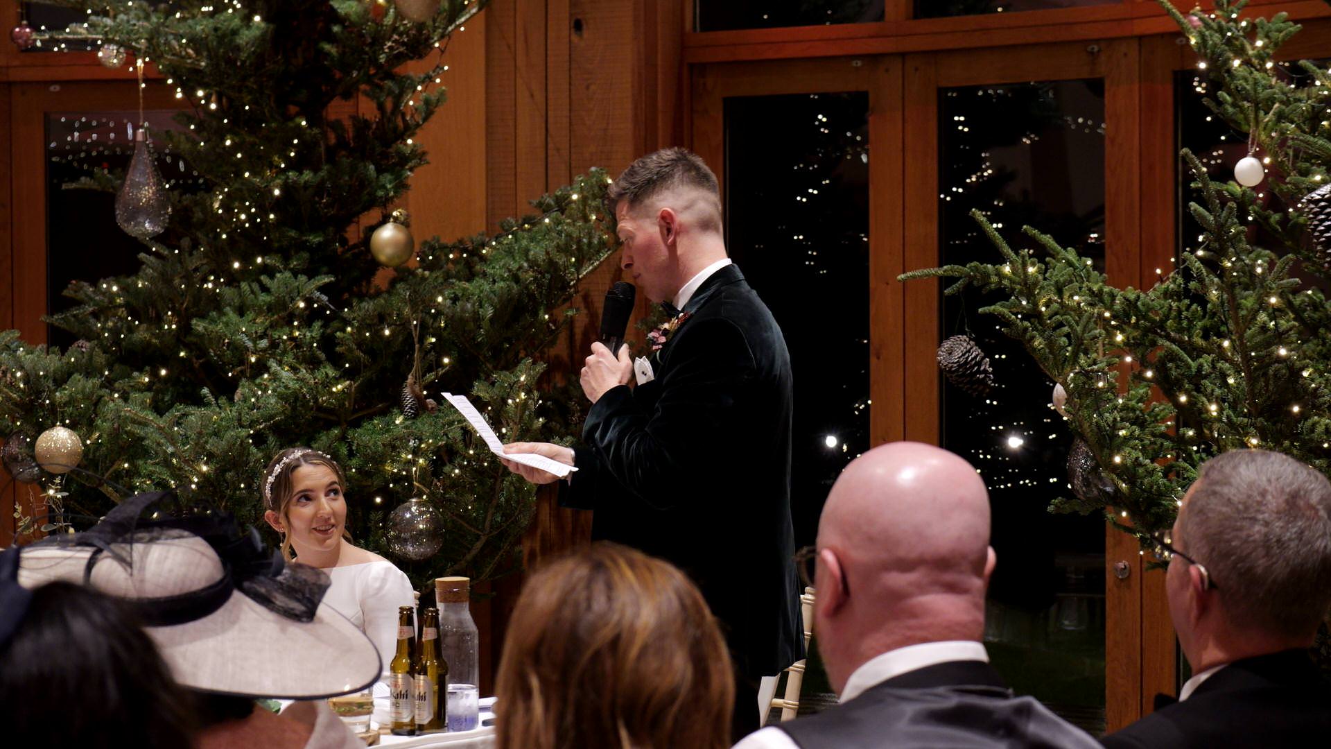 the groom delivers his speech at the Out Barn