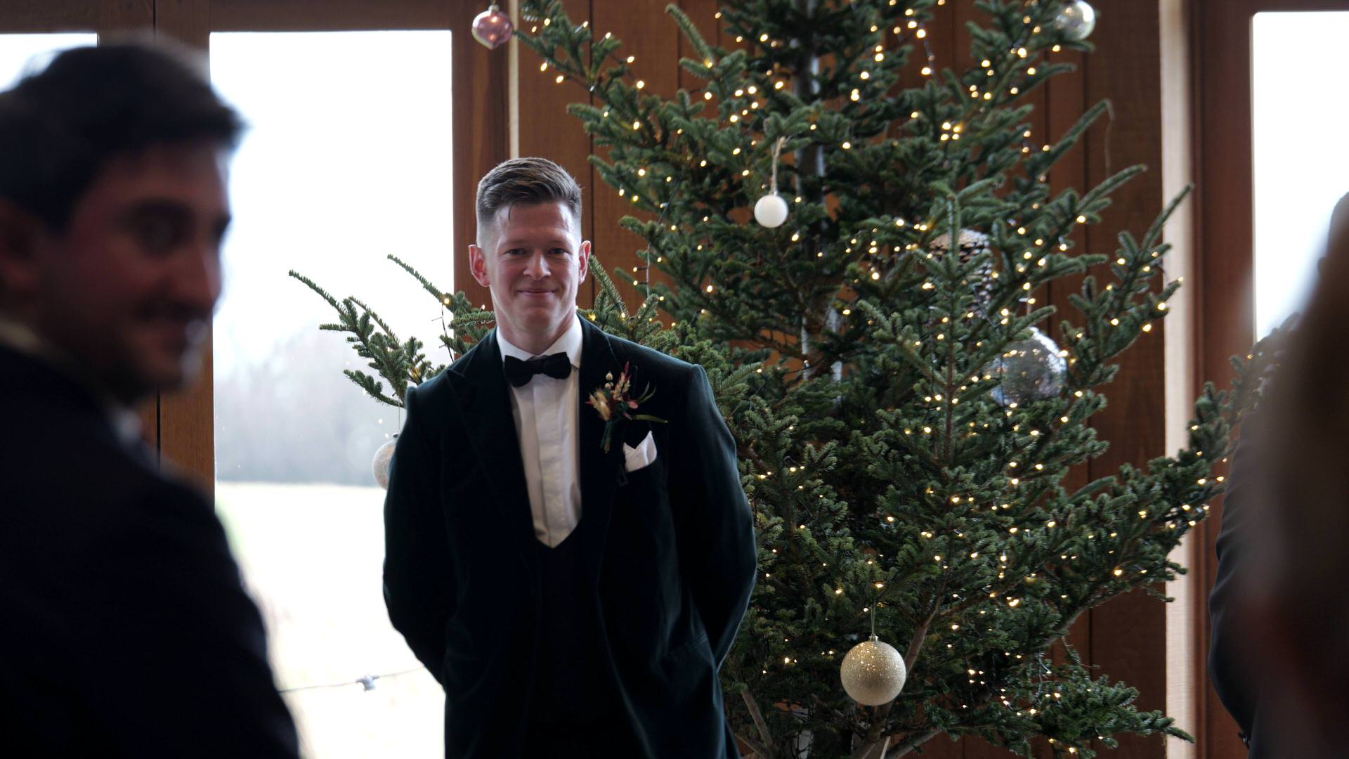 a grooms first look caught on video at the Out Barn