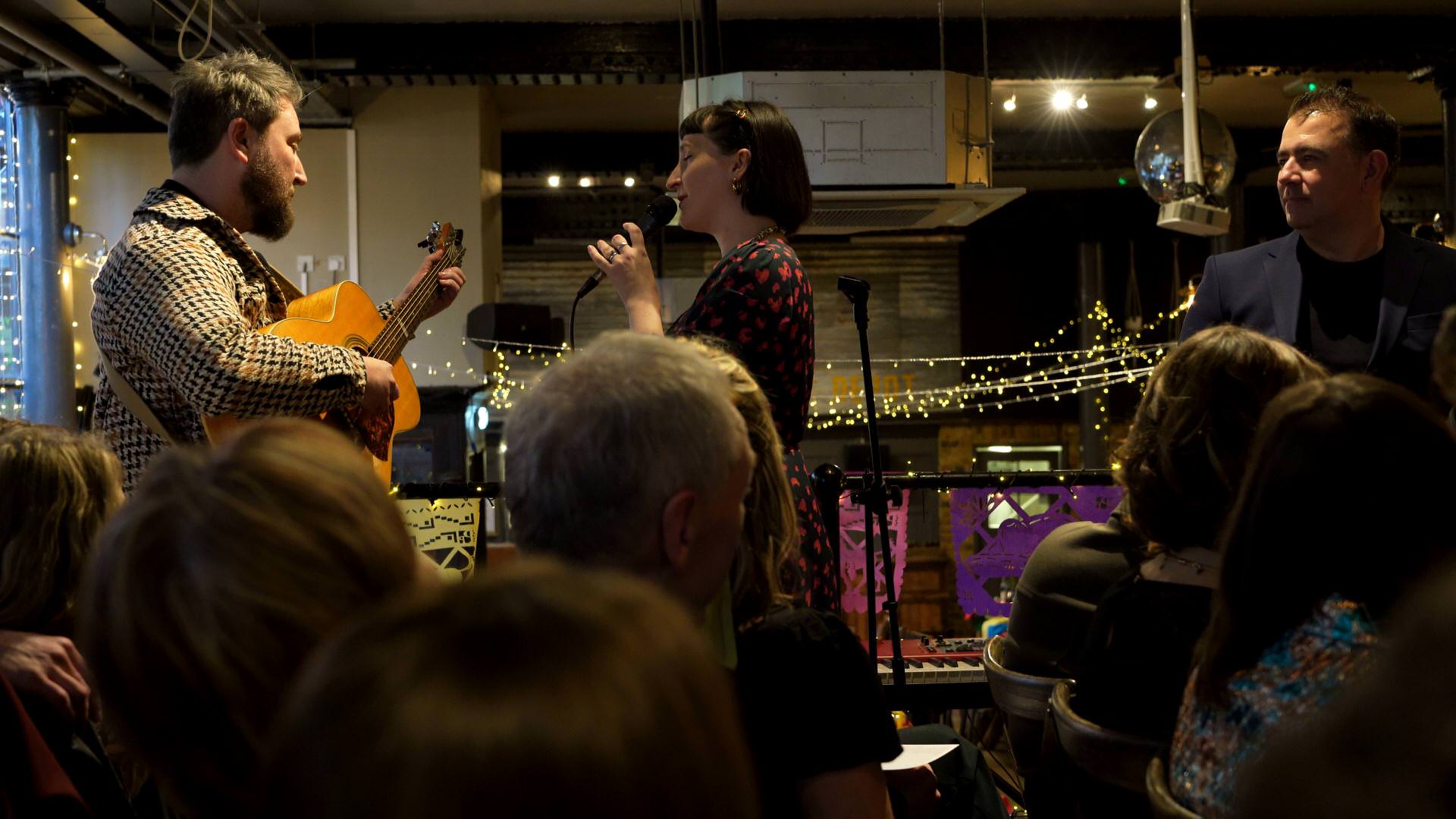 two friends sing Blackbird live during a wedding ceremony in London