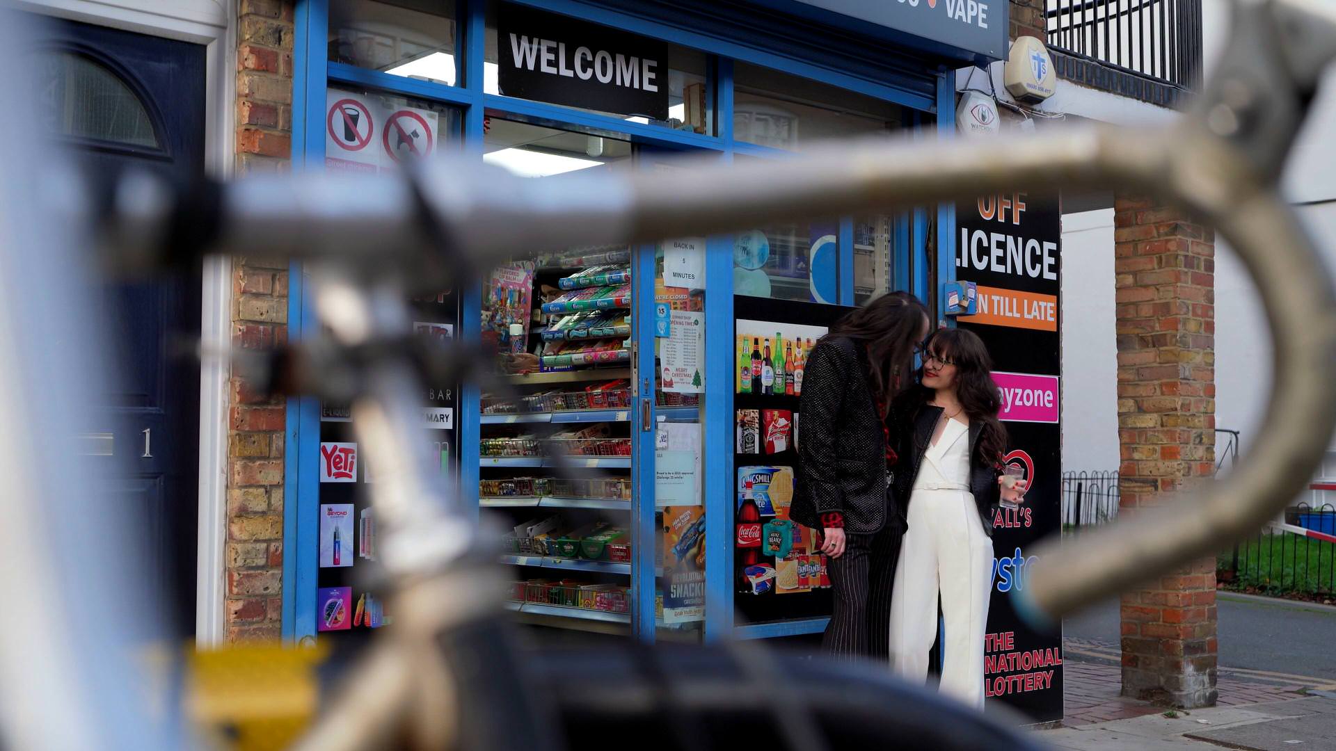 the couple captured on video taking a moment outside a newsagents in London