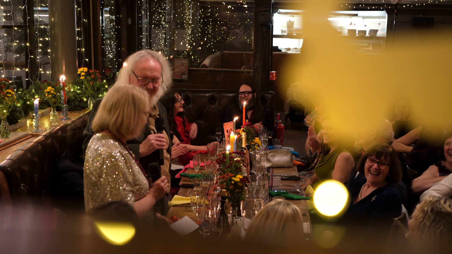 the couple laugh during the dads speech