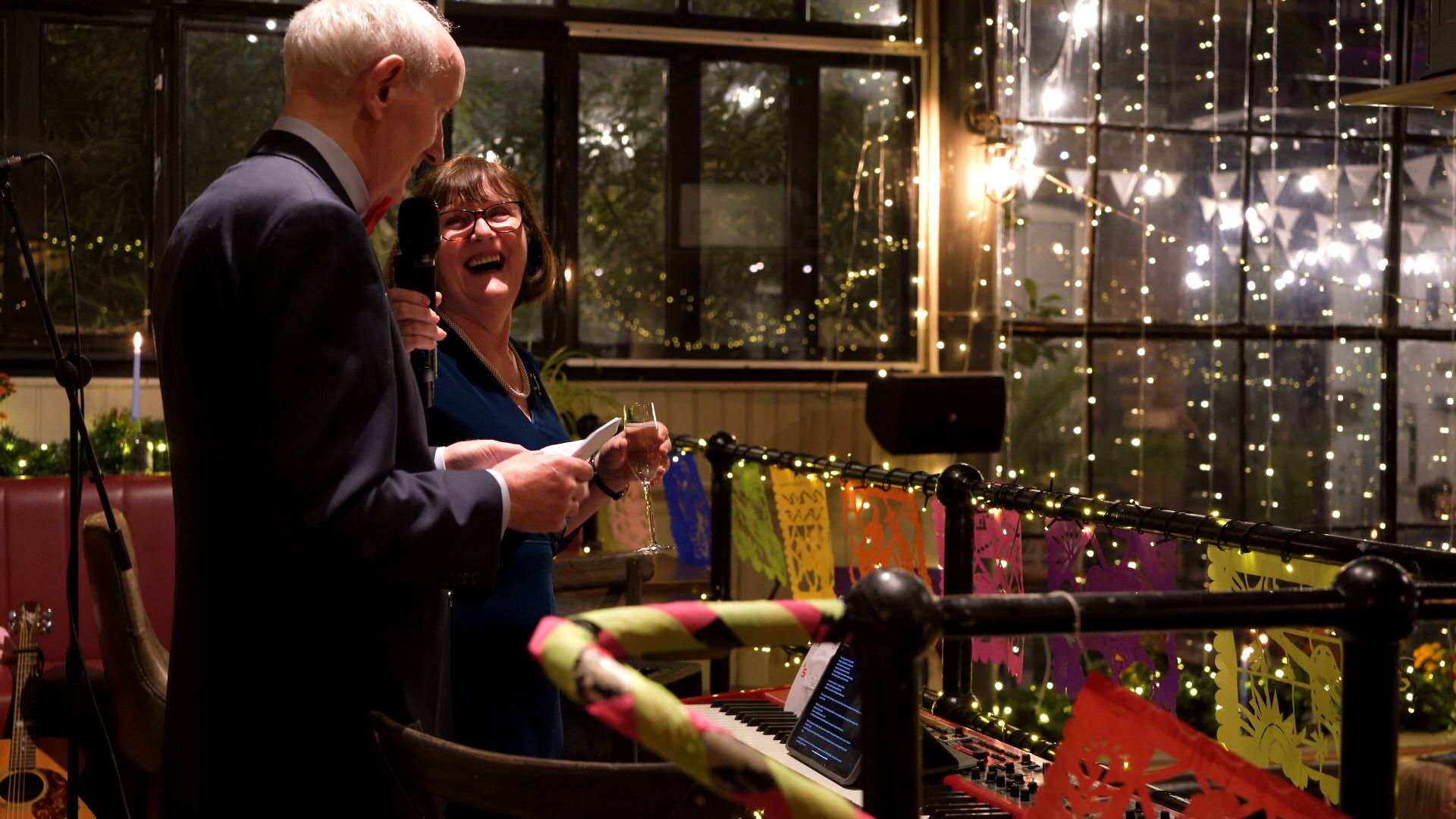 speakers laughing during the wedding speeches