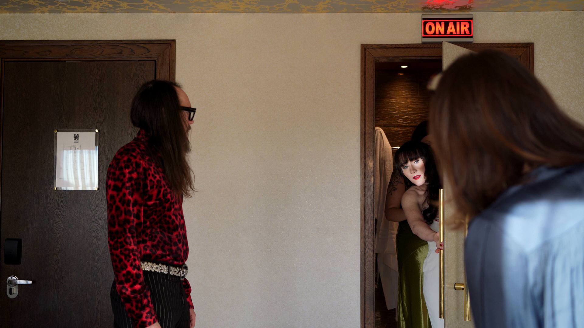 a videographer captured a bride leaning into natural light whilst getting ready at the Megaro hotel
