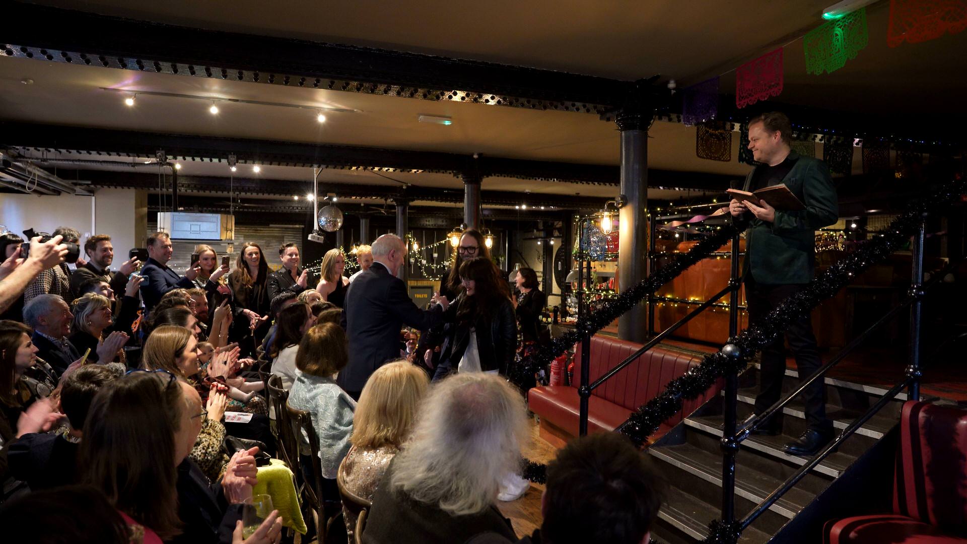 a wide video shot of a non traditional wedding ceremony at the Depot London