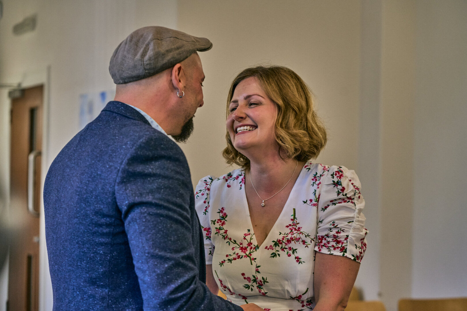 a bride and groom laugh and hold hands during Ormskirk registry office elopement