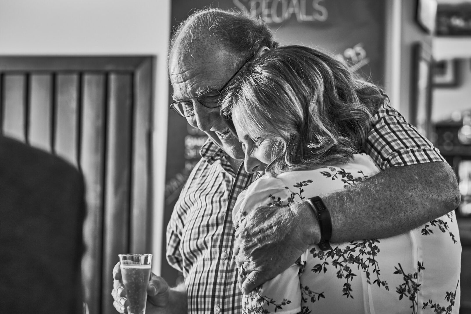 a dad gives his daughter a squeeze after finding out their going to get married at Ormskirk registry office