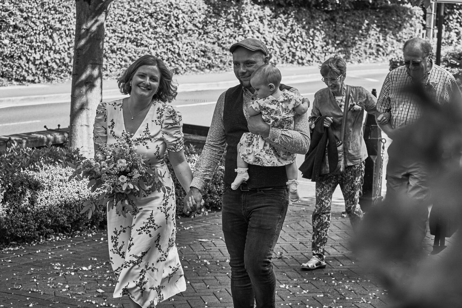 the couple and her parents walk towards Ormskirk registry office