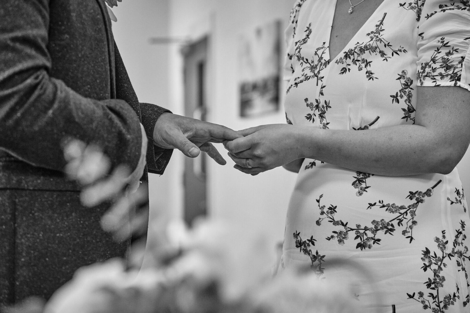 a close up photo of the couple exchanging wedding rings at Ormskirk registry office