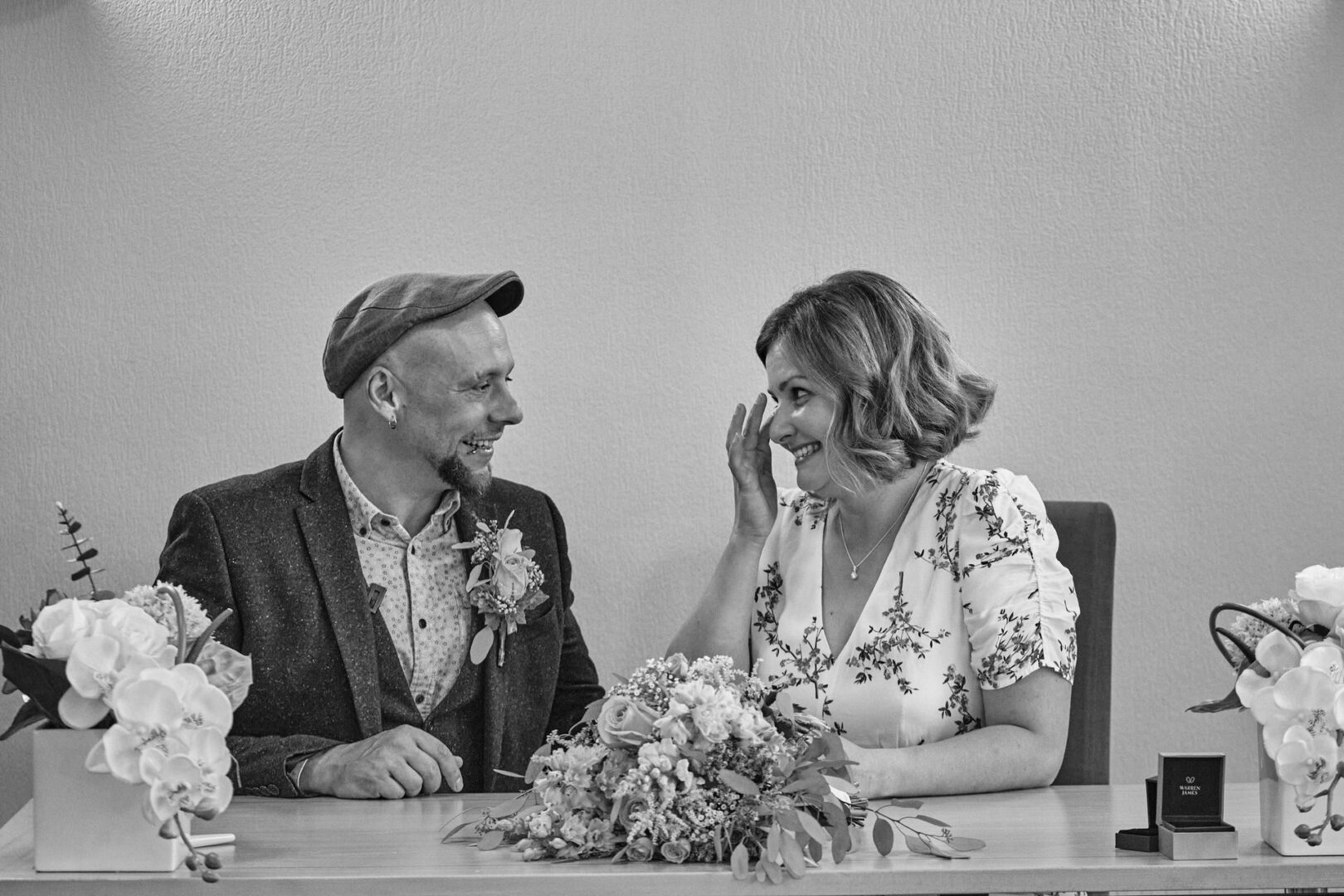 bride wiping a tear away caught in a photo during wedding ceremony at Ormskirk registry office