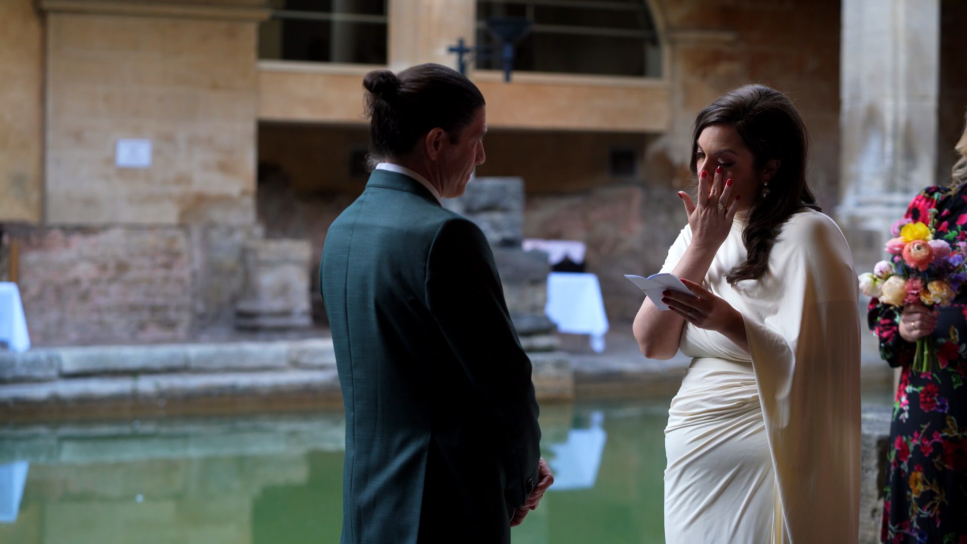 emotional moment as bride wipes away her tears during vow renewal