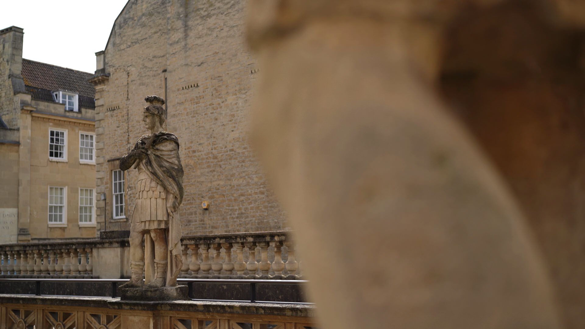 video still of statue within the Roman Baths