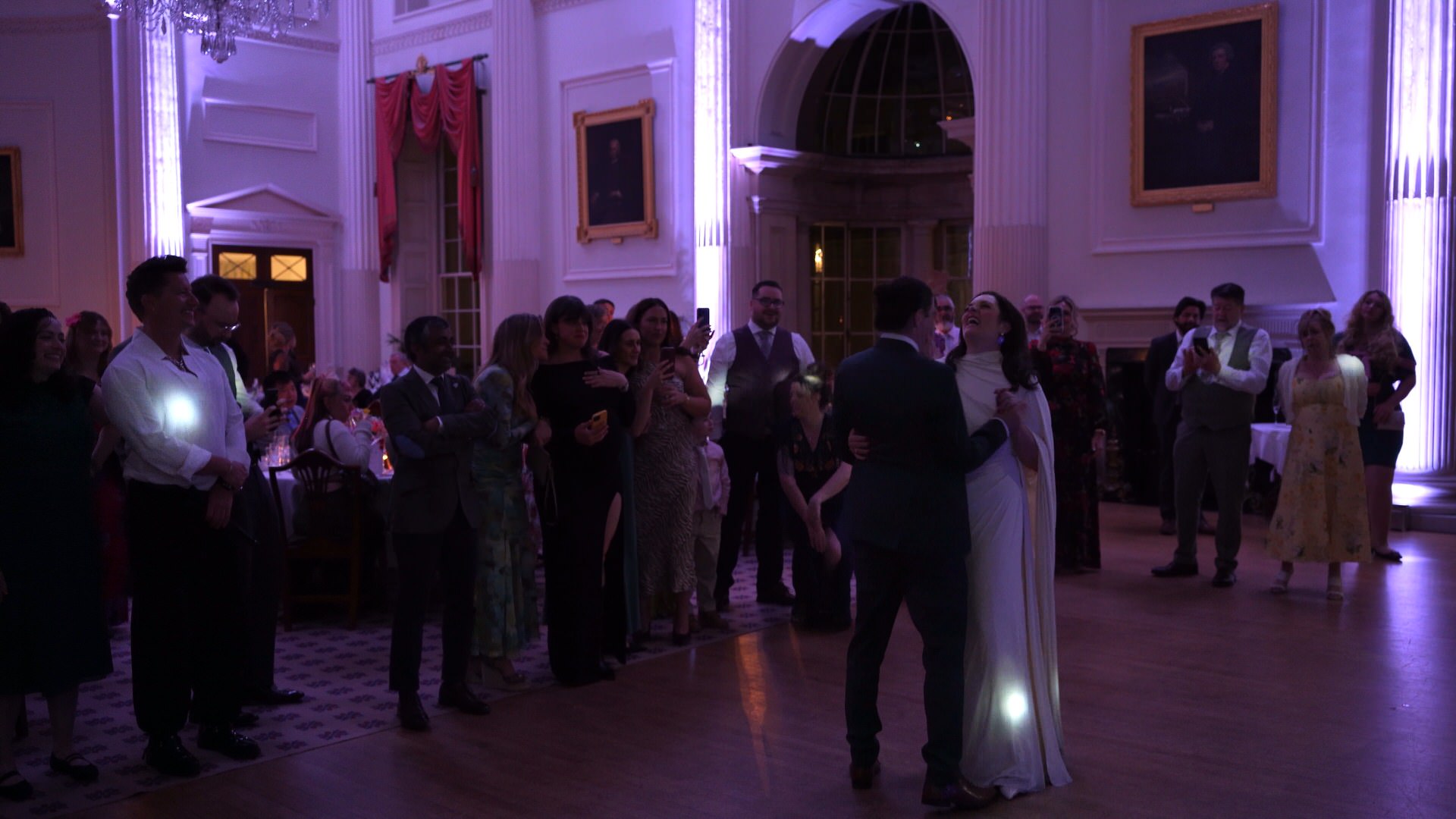the couple laugh during their first dance
