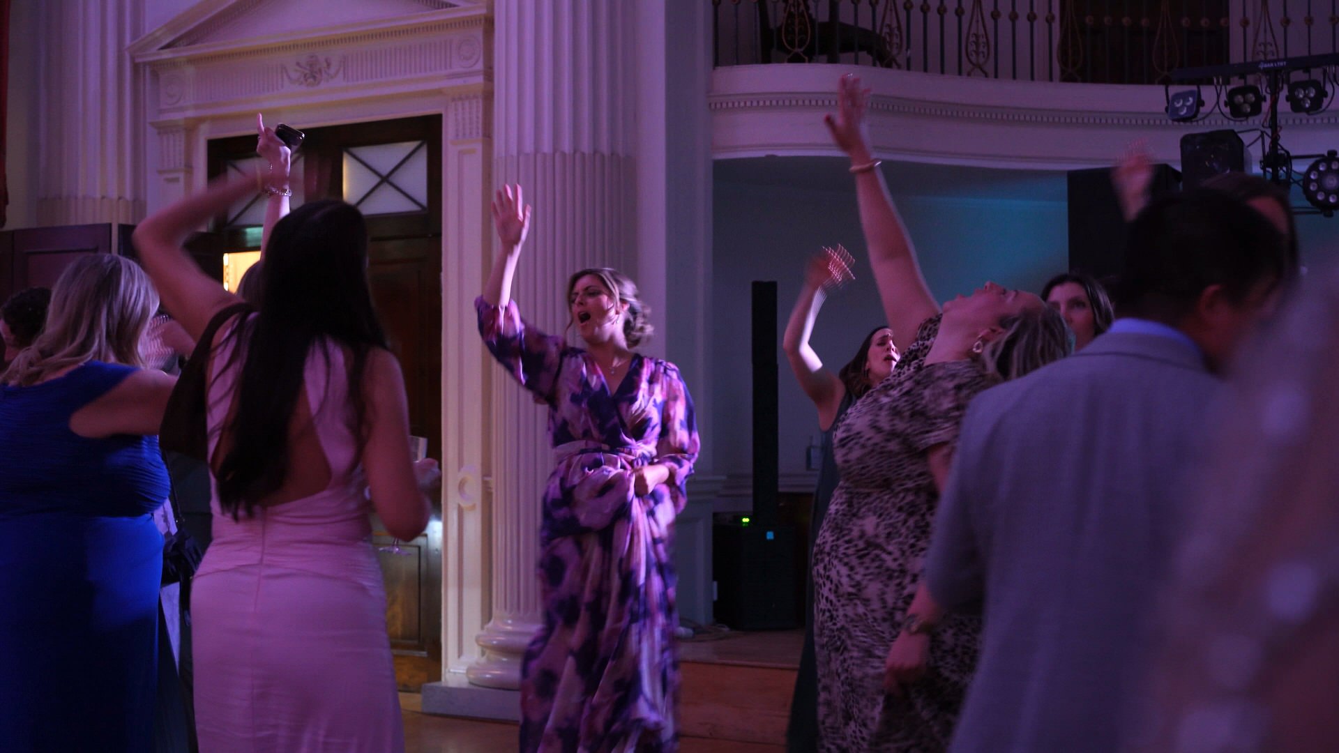 guests dance with arms in the air
