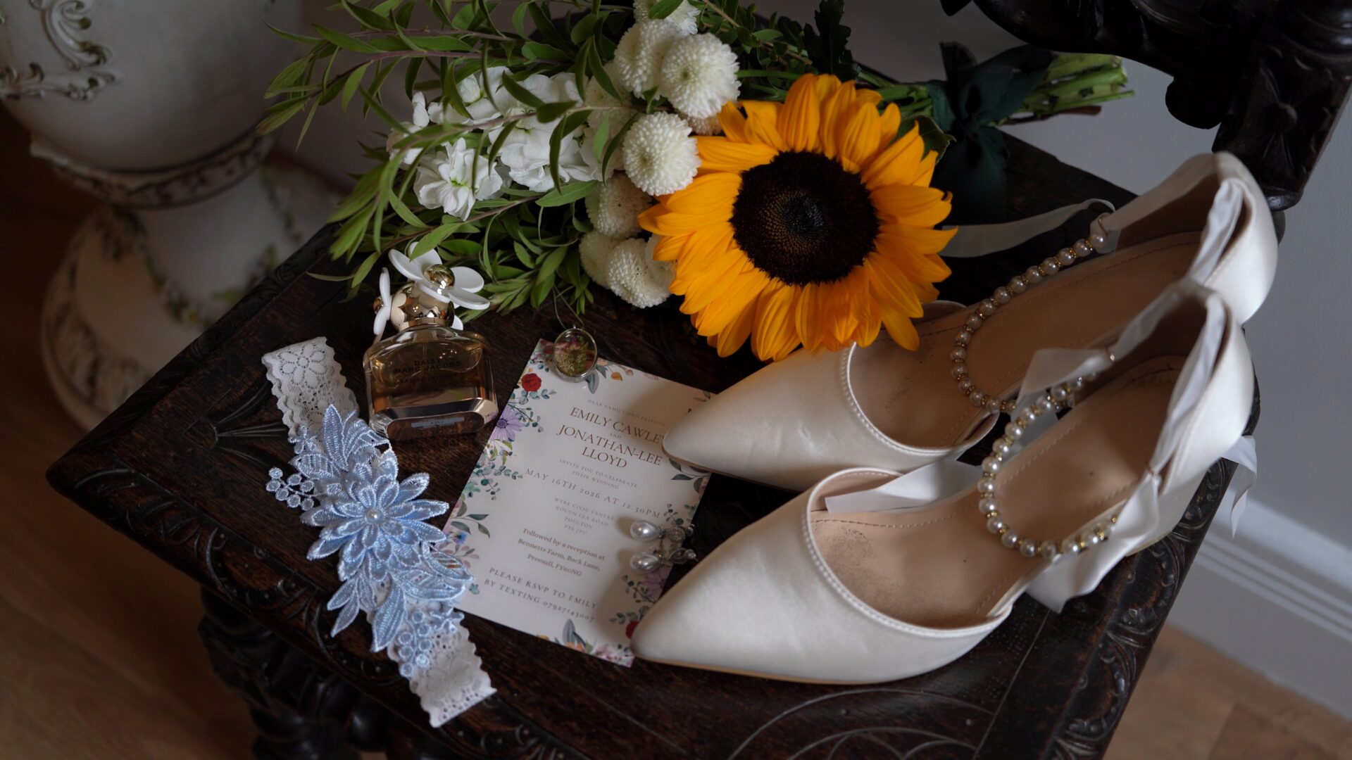 a flat lay of wedding details for a sunflower DIY wedding in Lancashire