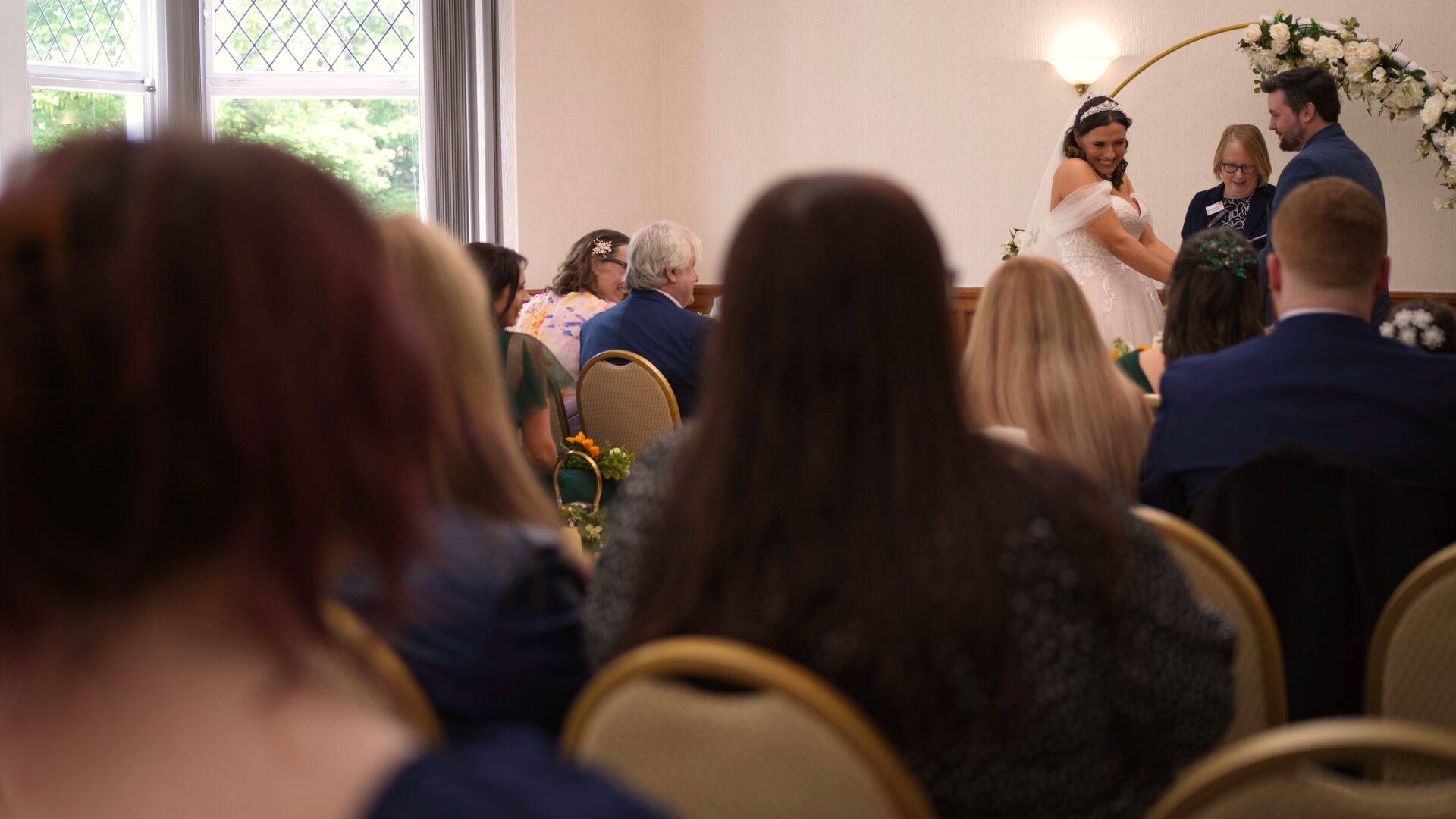 a nice candid moment captured during a wedding ceremony at Wyre Civic Centre