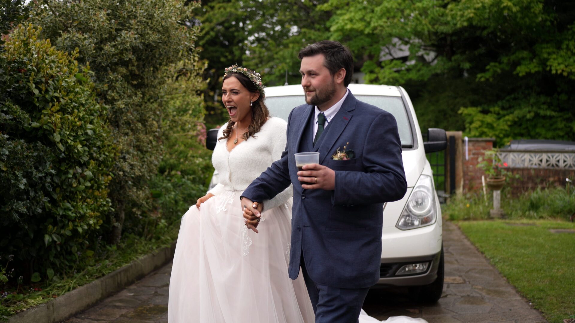 the couple cheer as they are announced into the reception marquee in Poulton-le-Fylde