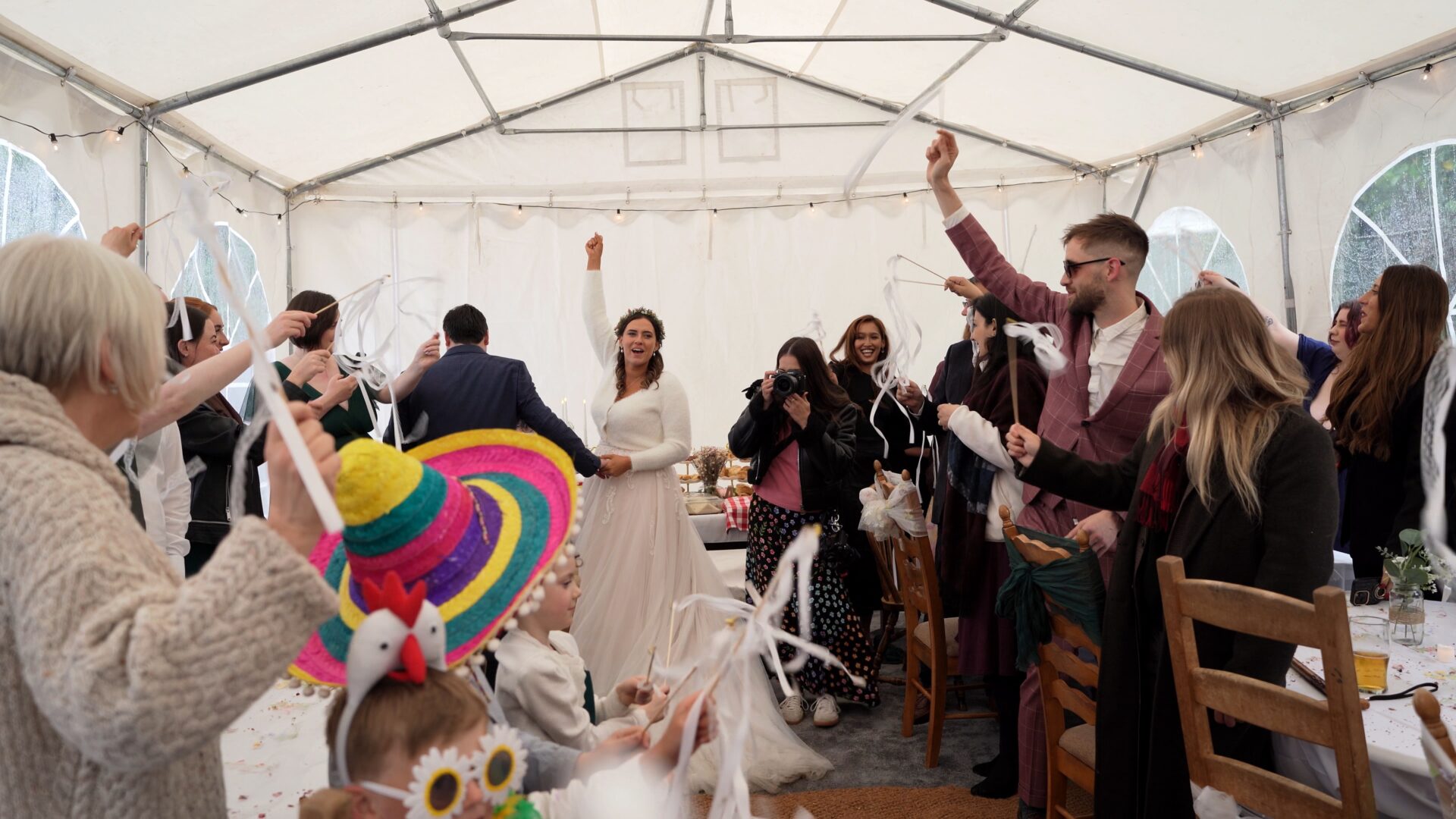 the bride cheers as she announces the family made buffet is now ready