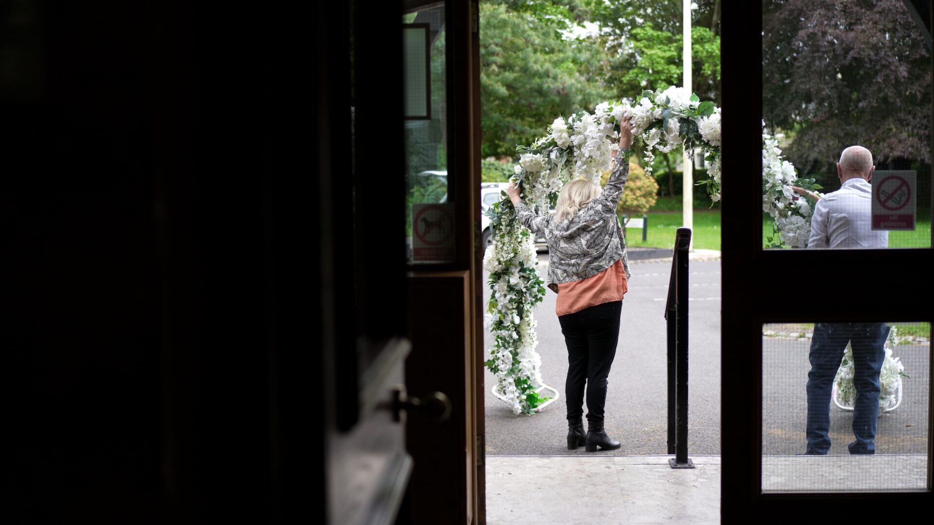 a flower arch is popped up outside Wyre Civic Centre for a wedding