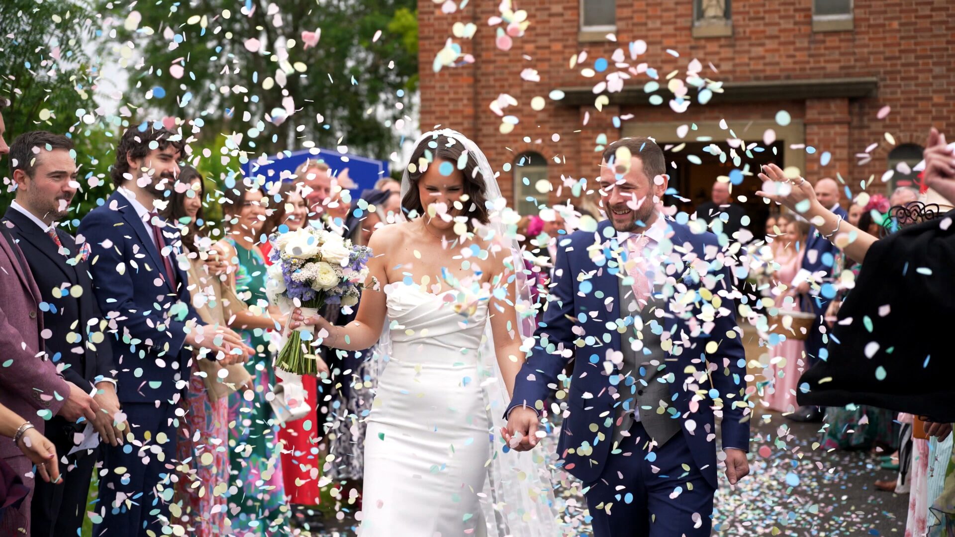 Flutter darlings confetti fills the air outside a wedding at St. Aelred's Catholic Church Harrogate