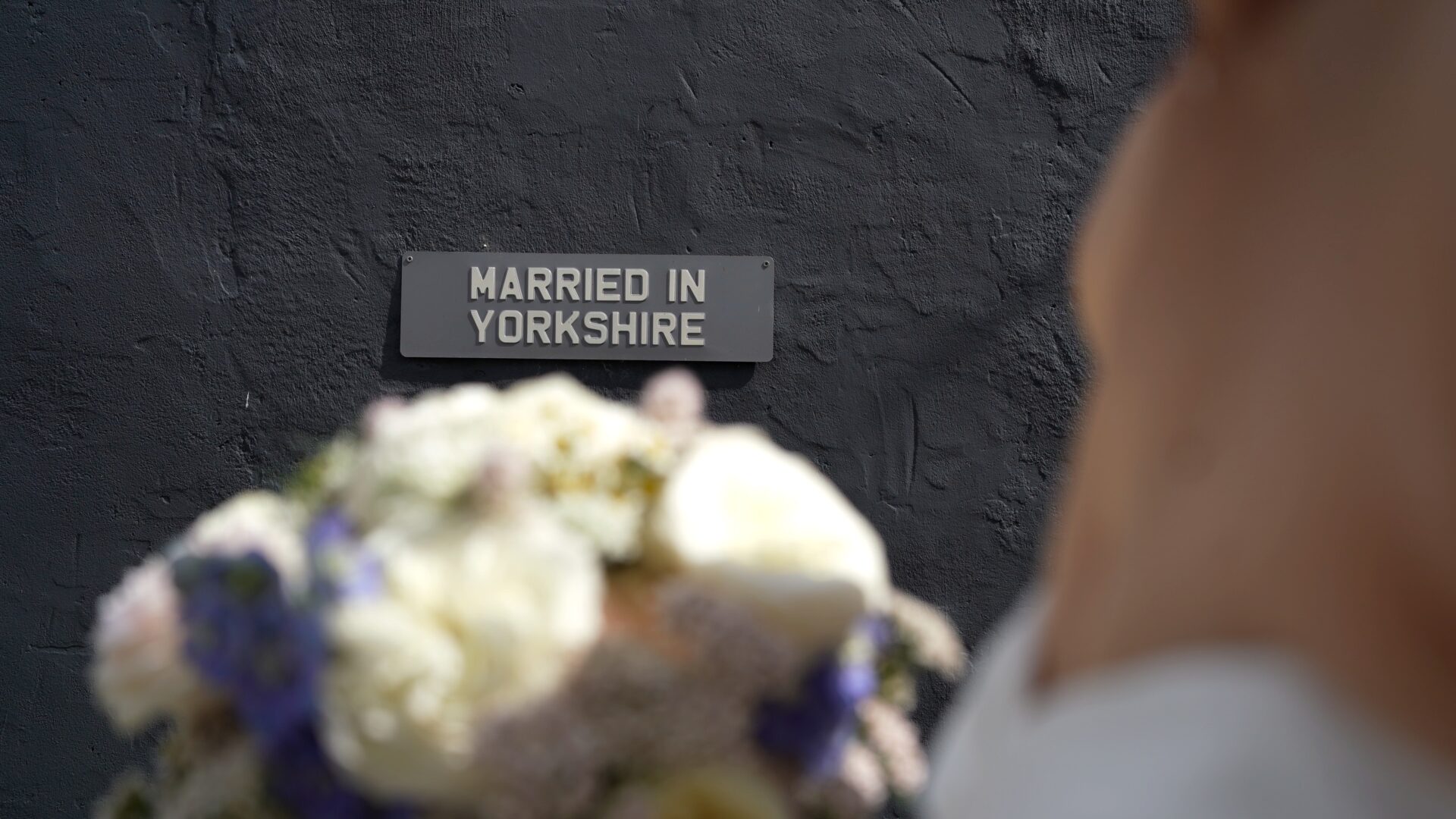a close up of a married in Yorkshire sign on a wall outside Wharfedale Grange near Harrogate