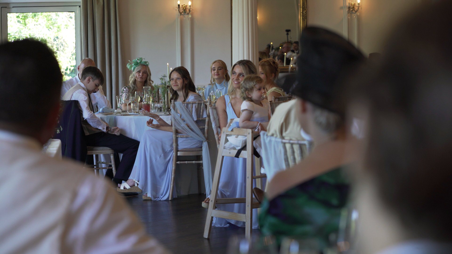 the couples children smile during the wedding speeches at Ashfield House
