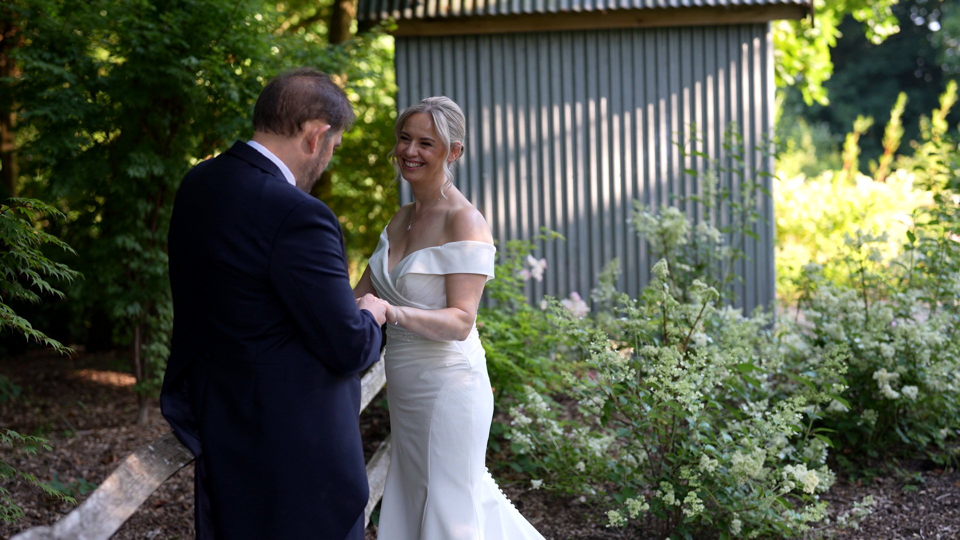 a candid natural moment of the couple in the gardens at Ashfield House