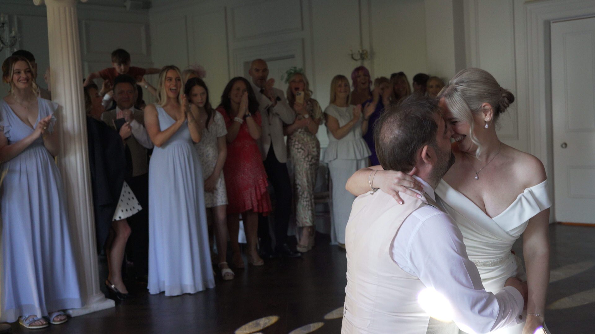 videographer captures the guests cheering after the first dance at Ashfield House