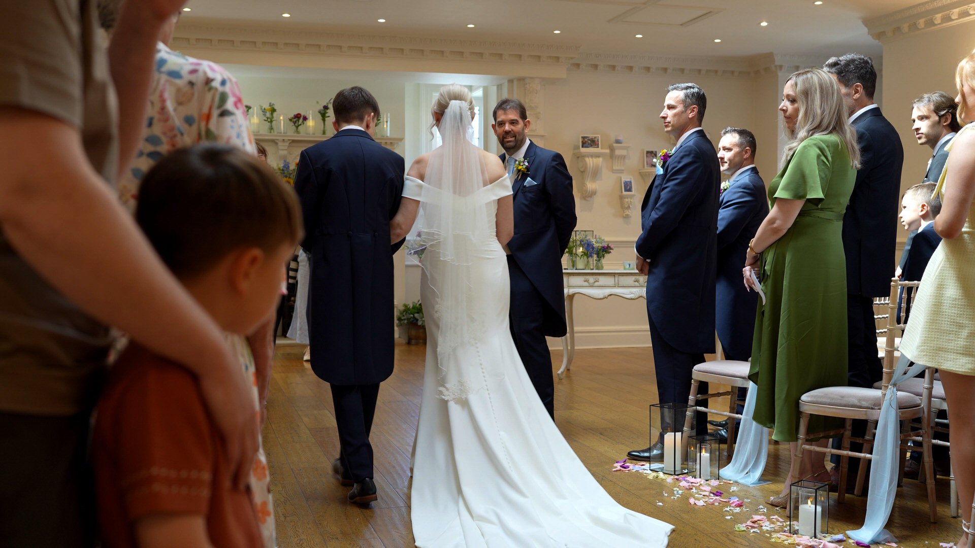 the groom smiles as he meets his bride at their Ashfield House wedding ceremony