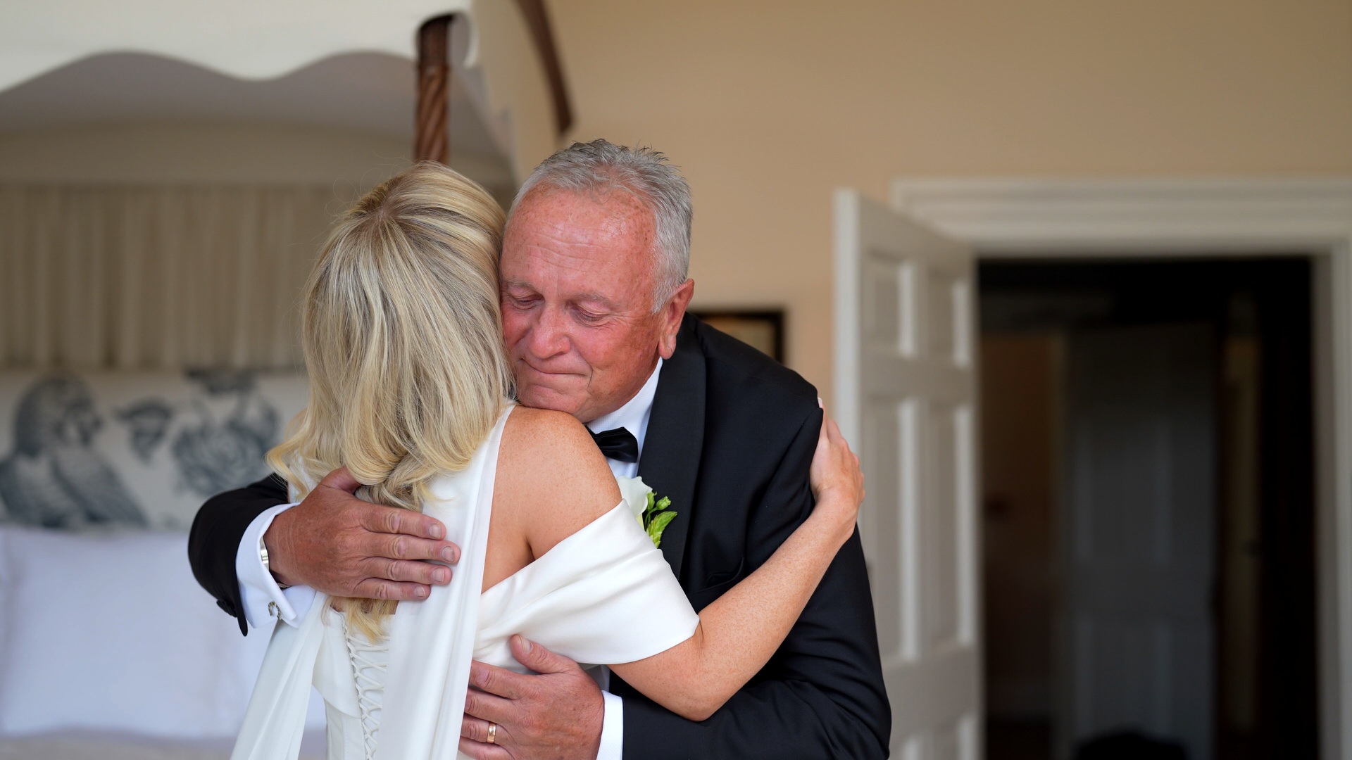 a dad hugs his daughter tightly during an emotional first look at at Iscoyd Park