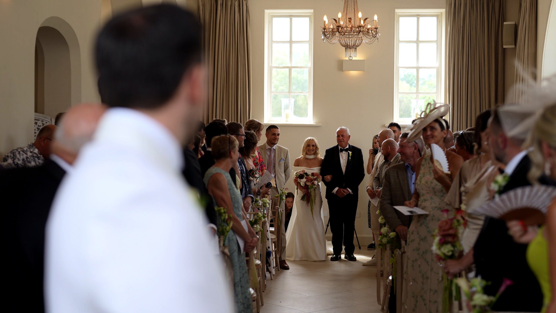 videographer captures the grooms first look of the bride at at Iscoyd Park