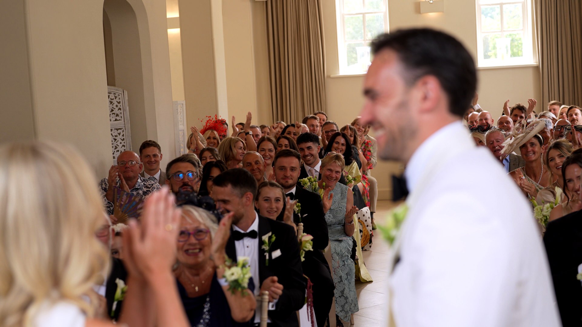 videographer films the guests reactions to the married couple at at Iscoyd Park