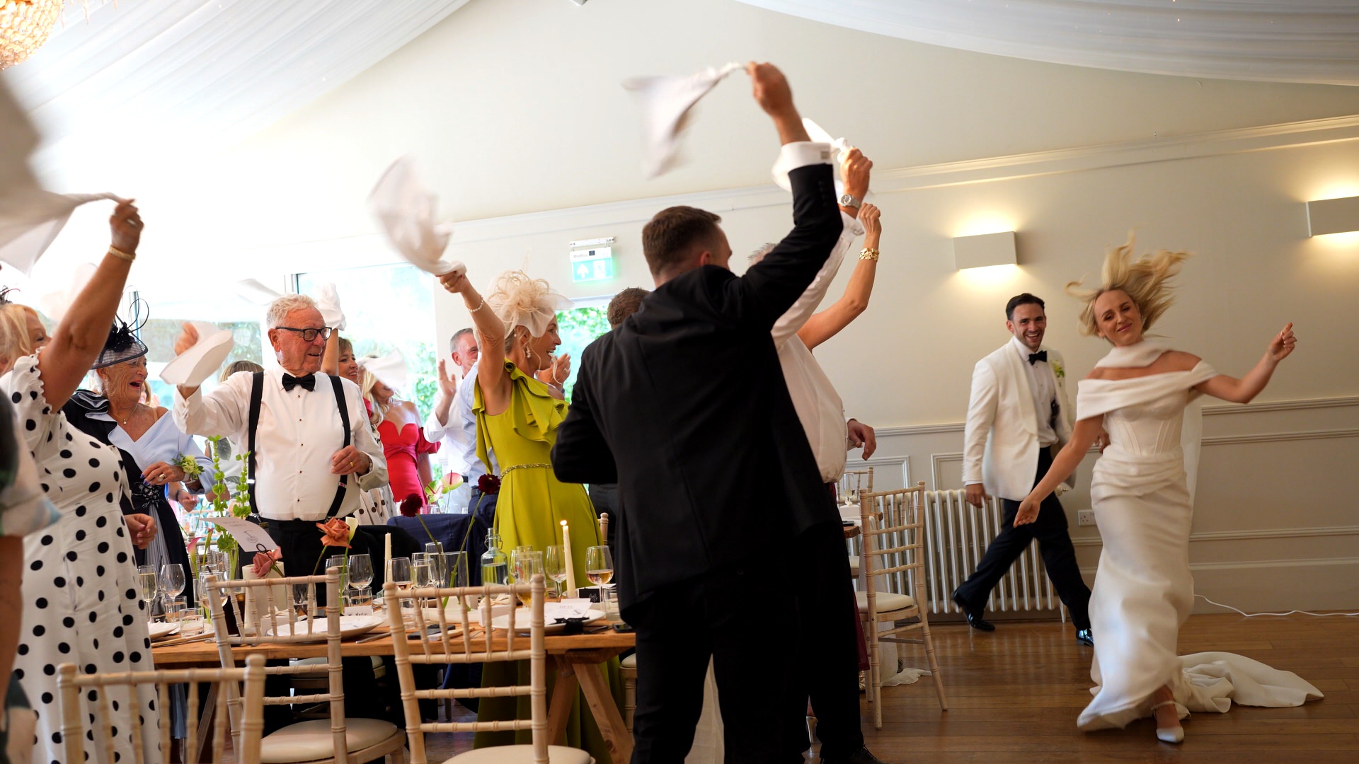 a fun video still of a grand entrance for the wedding breakfast at Iscoyd Park