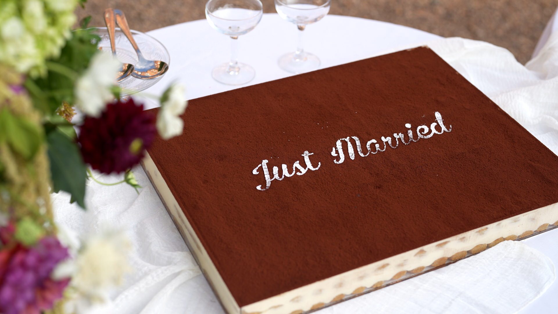 a close up of a just married tiramisu wedding cake
