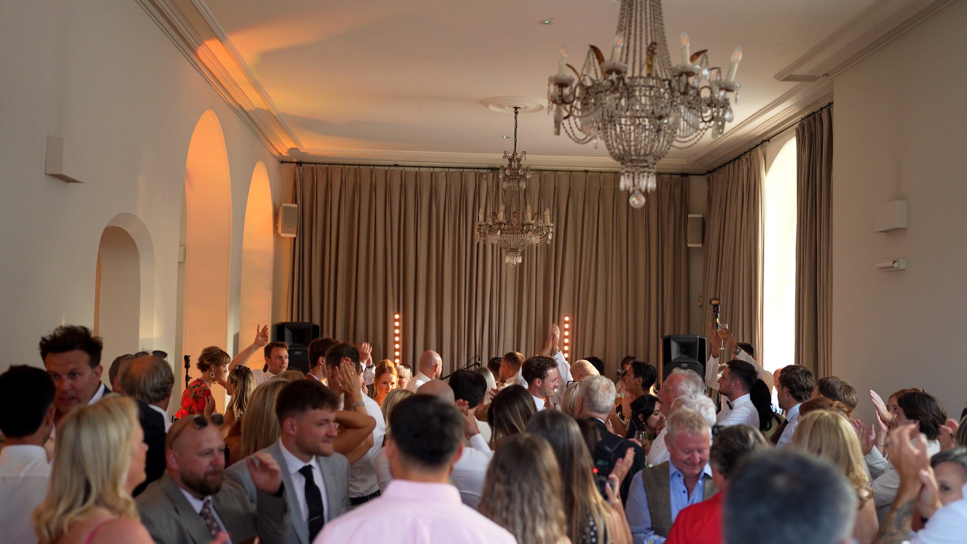 a wide shot of a full dancefloor in the garden room at Iscoyd Park