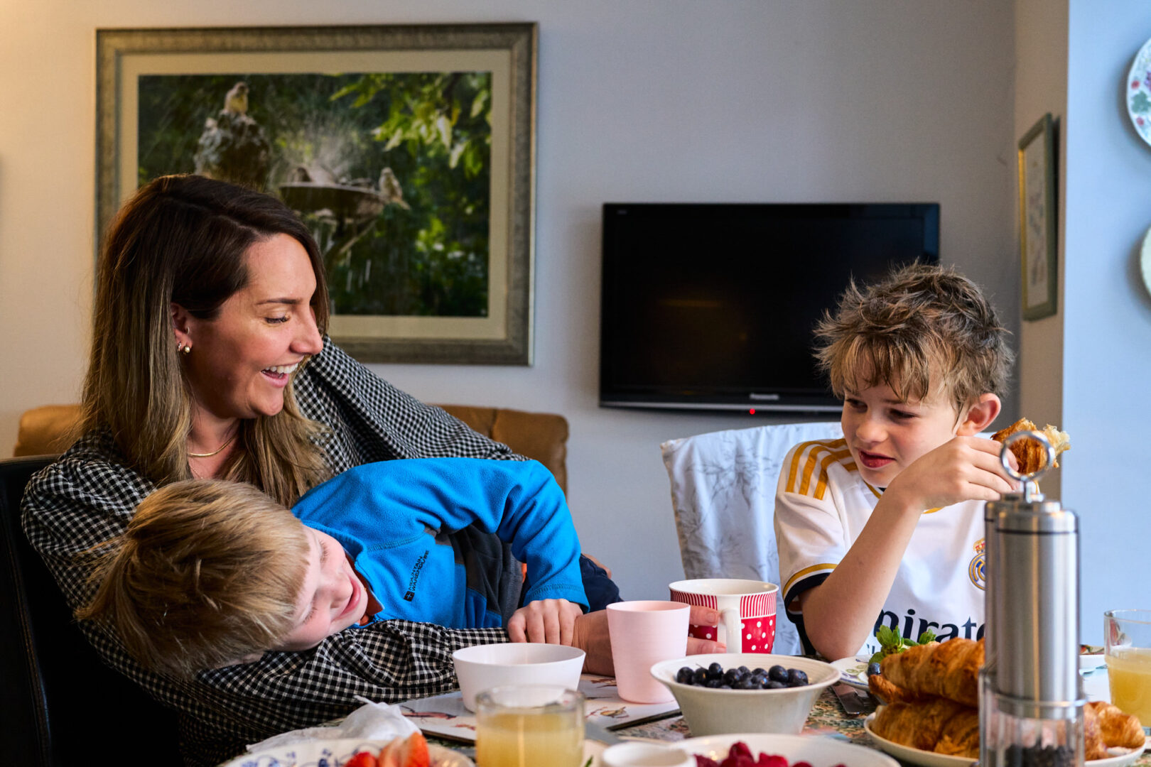 kids play and be silly during a photoshoot during brunch at home in Rufford