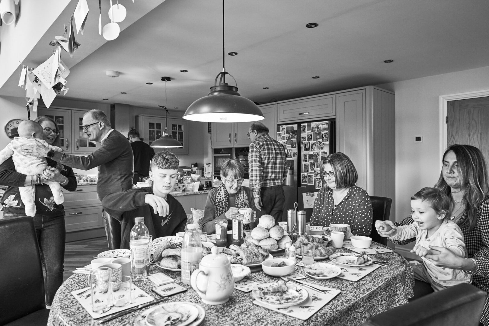 family chat at the breakfast table during a family photoshoot at home