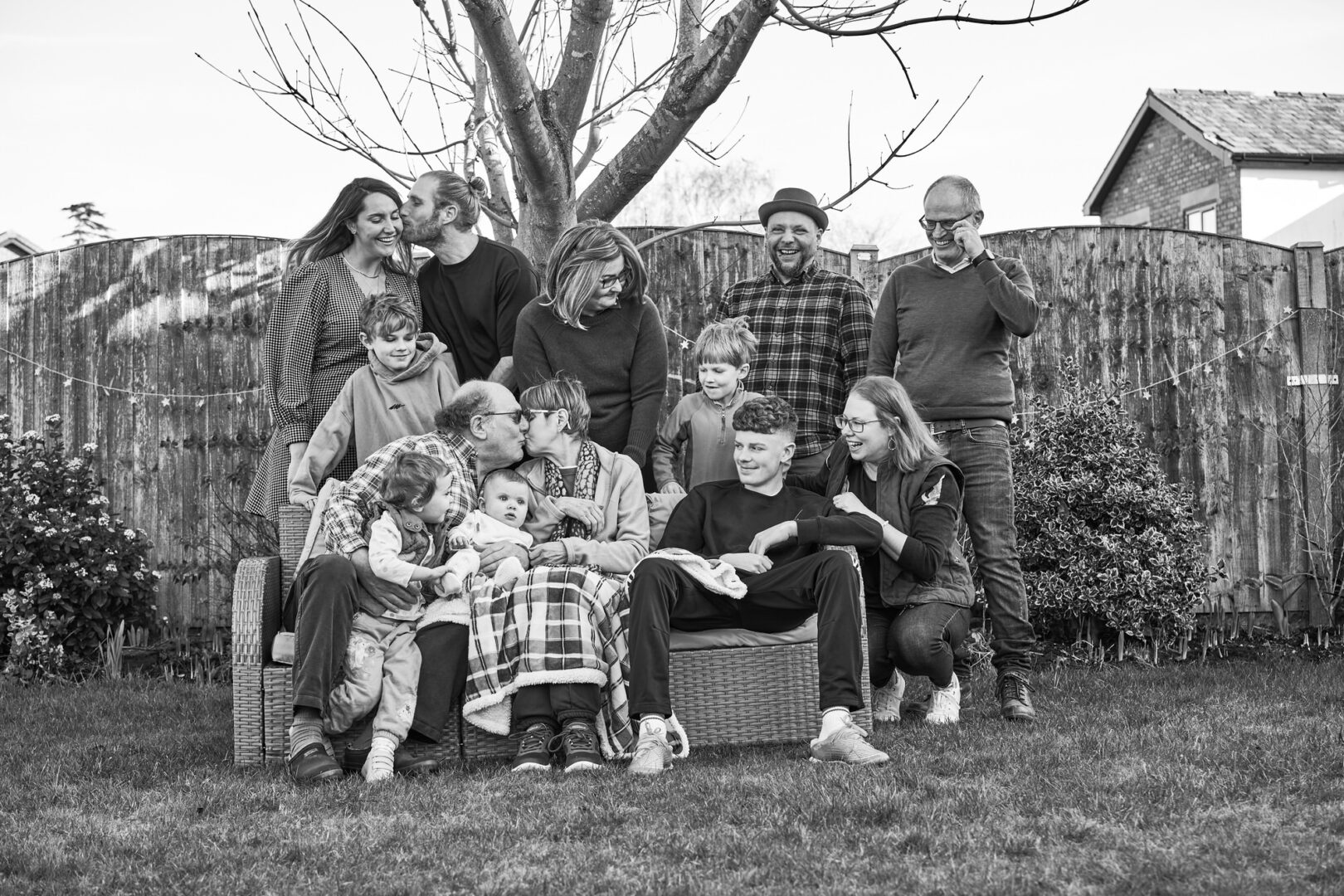a candid and relaxed group photo of an extended family at home in Lancashire